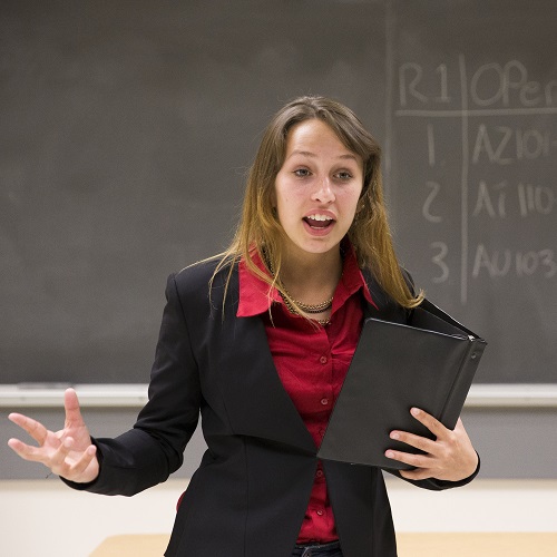 A female instructor conducting in her class